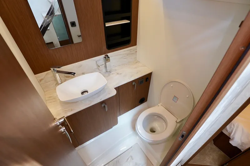  Yacht Photos Pics Modern bathroom in 2025 Prestige F5.7 yacht with sleek sink and toilet.