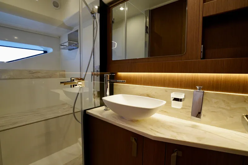  Yacht Photos Pics Luxurious bathroom in 2025 Prestige F5.7 yacht with modern fixtures and elegant design.