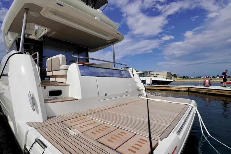  Yacht Photos Pics Luxury Prestige F5.7 yacht docked at marina, 2025 model, clear sky background.