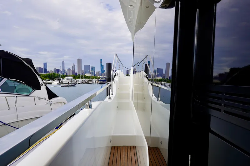  Yacht Photos Pics Modern Prestige F5.7 yacht with city skyline in the background, 2025 model.