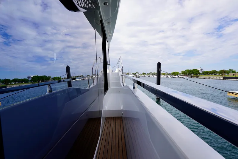  Yacht Photos Pics 2025 Prestige F5.7 yacht deck with scenic waterfront view.