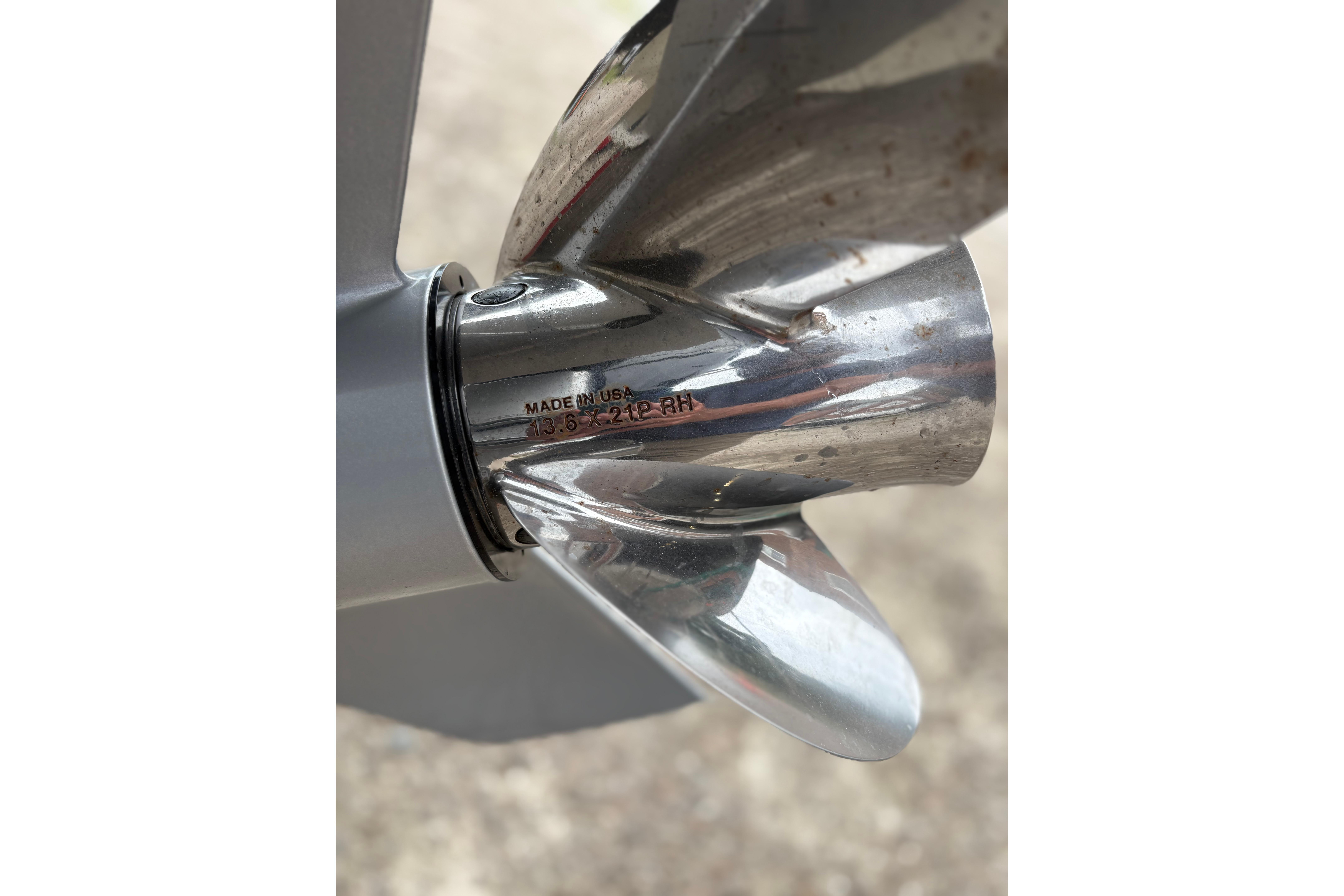 Close-up of a 2020 Protector 310 Targa boat propeller, showing "Made in USA" engraving.