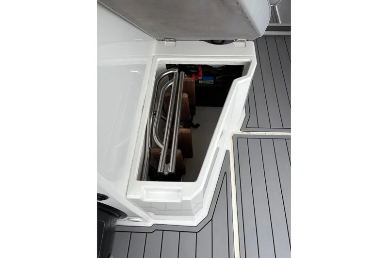 Protector Yacht Photos Pics Storage compartment on 2020 Protector 310 Targa boat with folded ladder and equipment.