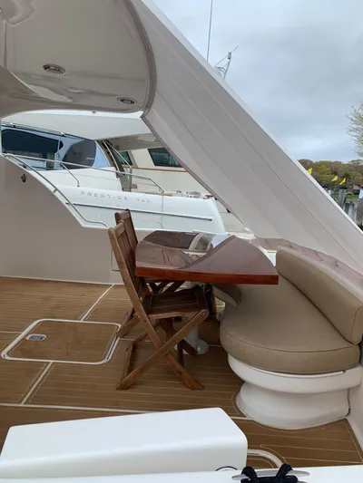  Yacht Photos Pics Luxurious 2004 Ocean Yachts 57 Odyssey with elegant outdoor seating and wooden deck.