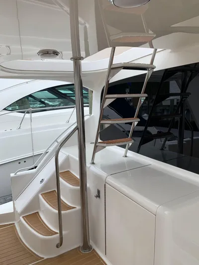  Yacht Photos Pics Staircase on 2004 Ocean Yachts 57 Odyssey, featuring sleek design and modern finishes.