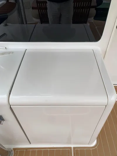  Yacht Photos Pics 2004 Ocean Yachts 57 Odyssey yacht deck detail with white storage compartment.