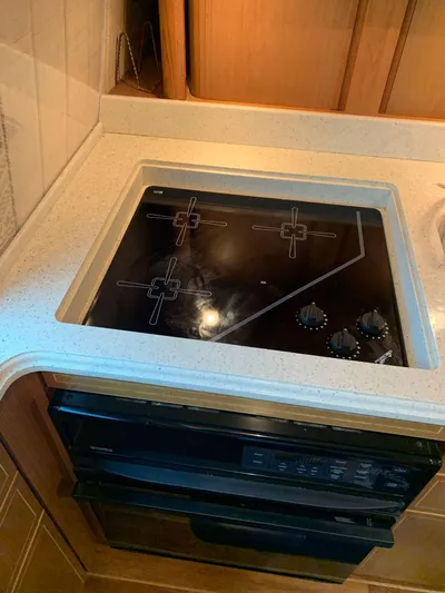  Yacht Photos Pics Stovetop in 2004 Ocean Yachts 57 Odyssey kitchen area.