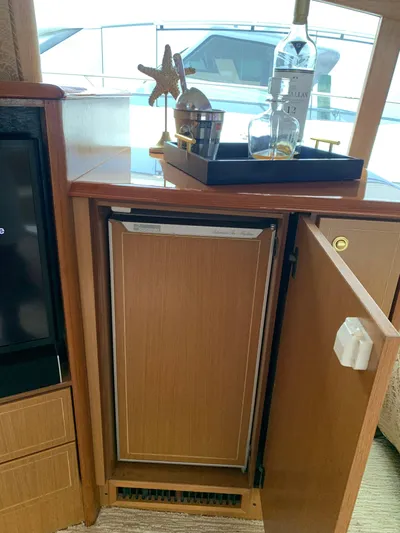  Yacht Photos Pics Luxury interior of 2004 Ocean Yachts 57 Odyssey with minibar and decor.