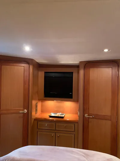  Yacht Photos Pics Luxurious 2004 Ocean Yachts 57 Odyssey interior with wood cabinetry and built-in TV.