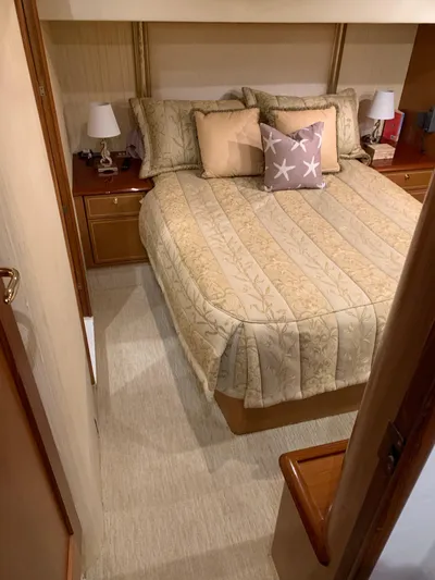  Yacht Photos Pics Luxurious bedroom in 2004 Ocean Yachts 57 Odyssey with elegant bedding and decor.