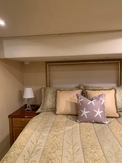  Yacht Photos Pics Luxurious bedroom interior of 2004 Ocean Yachts 57 Odyssey with elegant bedding and decor.