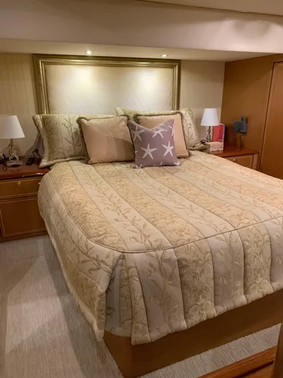  Yacht Photos Pics Luxurious bedroom in 2004 Ocean Yachts 57 Odyssey with elegant bedding and ambient lighting.