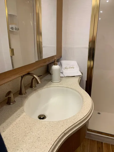  Yacht Photos Pics Luxurious bathroom in 2004 Ocean Yachts 57 Odyssey with elegant fixtures and modern design.