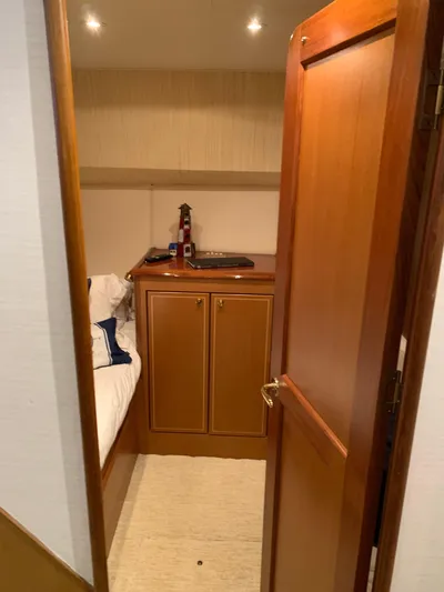  Yacht Photos Pics Cozy cabin interior of 2004 Ocean Yachts 57 Odyssey with wooden furnishings.