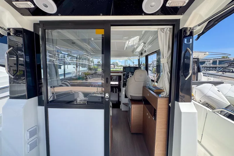  Yacht Photos Pics Interior view of 2018 Jeanneau NC 895 boat, featuring modern design and spacious cabin.