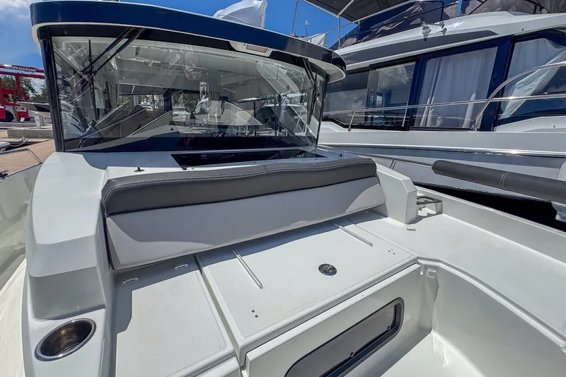  Yacht Photos Pics 2018 Jeanneau NC 895 boat deck with seating and windshield.