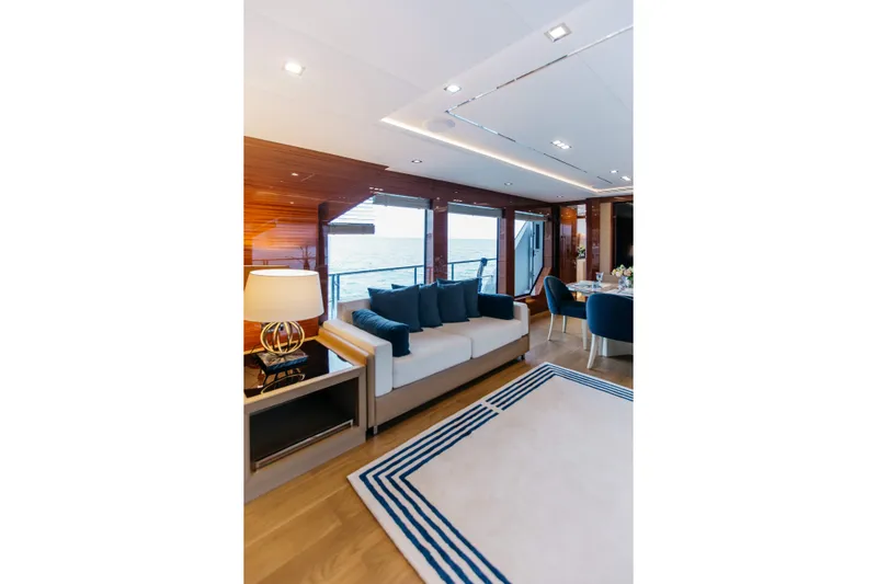 Papillon Yacht Photos Pics Luxurious interior of 2022 Bering 92 yacht with elegant seating and ocean view.
