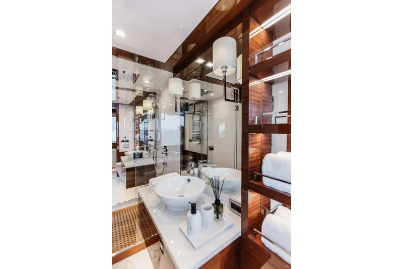 Papillon Yacht Photos Pics Luxurious bathroom interior on 2022 Bering 92 yacht with modern fixtures and elegant design.