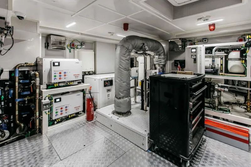Papillon Yacht Photos Pics Engine room of 2022 Bering 92 yacht with advanced machinery and control systems.