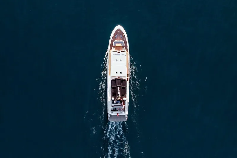 Papillon Yacht Photos Pics Aerial view of 2022 Bering 92 yacht cruising on open water.