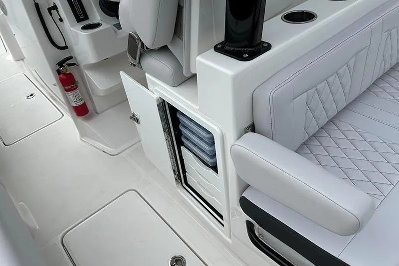  Yacht Photos Pics 2025 Fountain 38 Center Console interior with white seating and storage compartments.