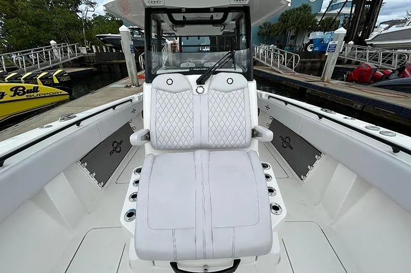  Yacht Photos Pics 2025 Fountain 38 Center Console boat with luxurious white seating and modern design.
