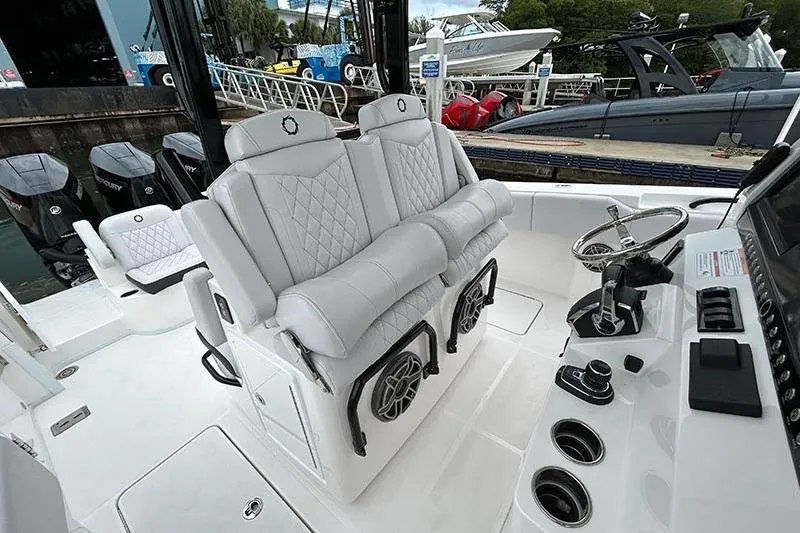  Yacht Photos Pics 2025 Fountain 38 Center Console boat interior with luxurious seating and modern controls.