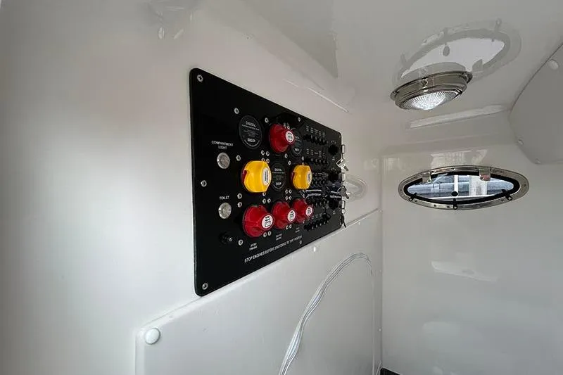  Yacht Photos Pics 2025 Fountain 38 Center Console control panel with switches and indicators.