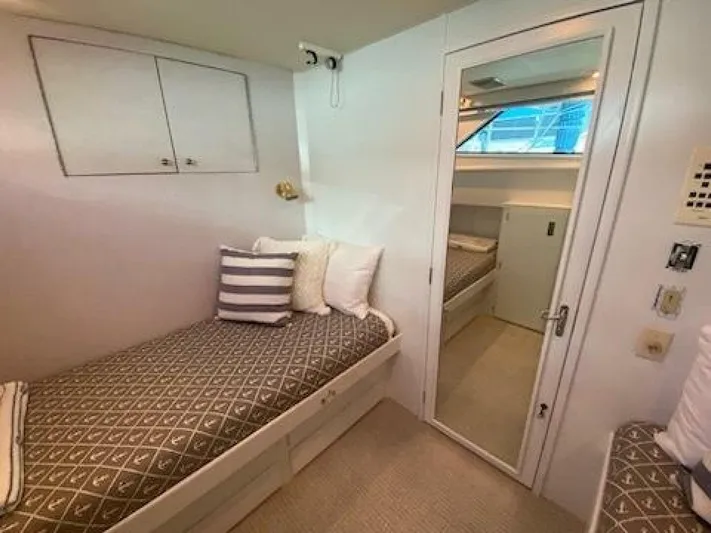  Yacht Photos Pics 1989 Hatteras Custom Cockpit cabin interior with cozy bed and modern decor.