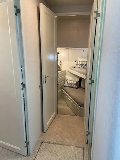  Yacht Photos Pics 1989 Hatteras Custom Cockpit interior with cozy bunk beds and modern decor.