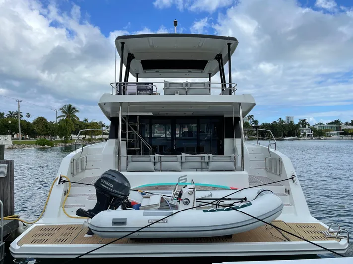 Fina Yacht Photos Pics 2020 Fountaine Pajot MY 44 yacht docked with inflatable boat on deck.