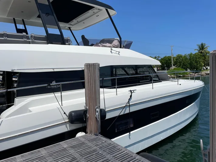 Fina Yacht Photos Pics 2020 Fountaine Pajot MY 44 yacht docked, showcasing sleek design and modern features.