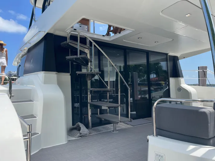 Fina Yacht Photos Pics Fountaine Pajot MY 44 yacht, 2020 model, featuring sleek design and spiral staircase.