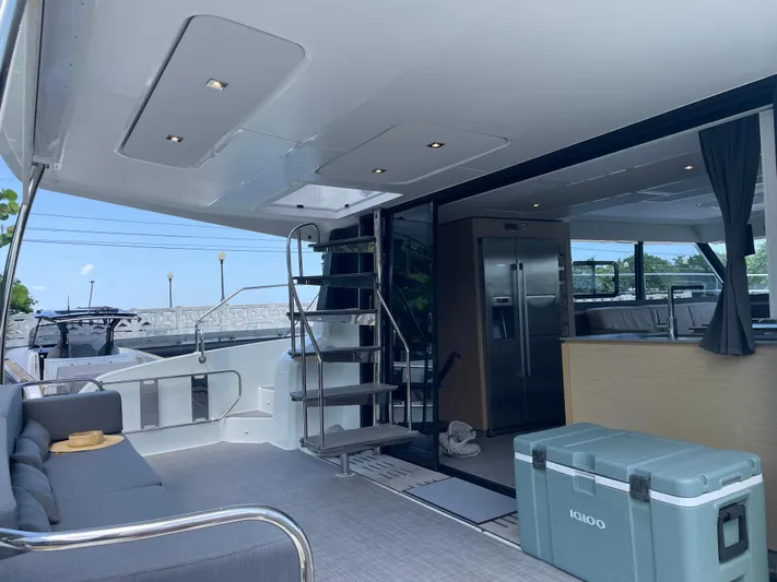 Fina Yacht Photos Pics Luxury interior of 2020 Fountaine Pajot MY 44 yacht with modern amenities and seating area.