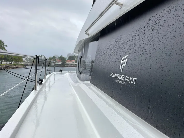 Fina Yacht Photos Pics 2020 Fountaine Pajot MY 44 yacht in rainy weather, dockside view.