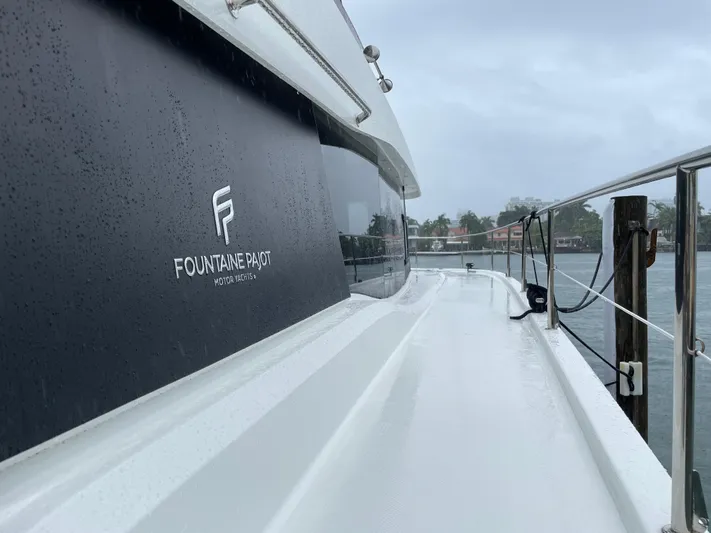 Fina Yacht Photos Pics Fountaine Pajot MY 44 yacht, 2020 model, on a rainy day by the water.