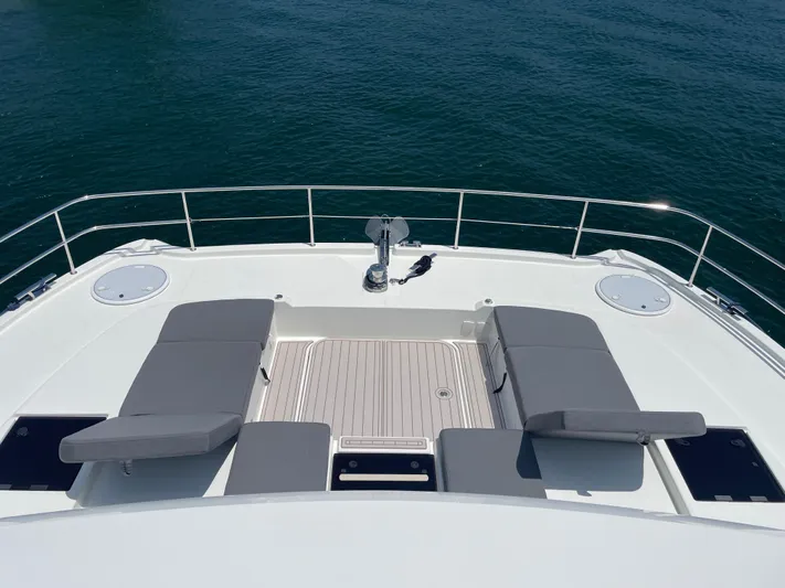 Fina Yacht Photos Pics Fountaine Pajot MY 44 2020 yacht deck with cushioned seating and ocean view.