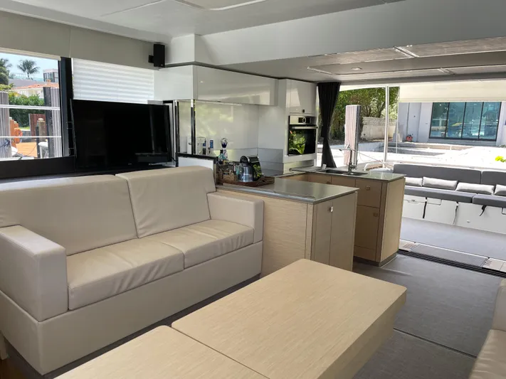 Fina Yacht Photos Pics Luxurious interior of 2020 Fountaine Pajot MY 44 yacht with modern furnishings and spacious layout.