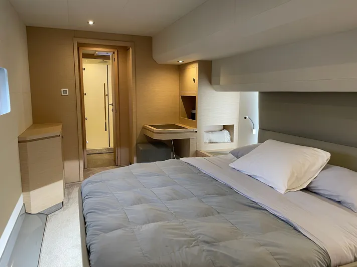 Fina Yacht Photos Pics Luxurious bedroom interior of 2020 Fountaine Pajot MY 44 yacht, featuring modern design and cozy bedding.