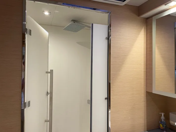 Fina Yacht Photos Pics Modern shower in 2020 Fountaine Pajot MY 44 yacht bathroom, featuring sleek design and lighting.