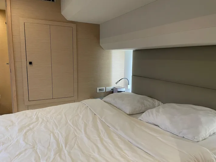 Fina Yacht Photos Pics Bedroom interior of 2020 Fountaine Pajot MY 44 yacht, featuring a cozy bed and modern design.