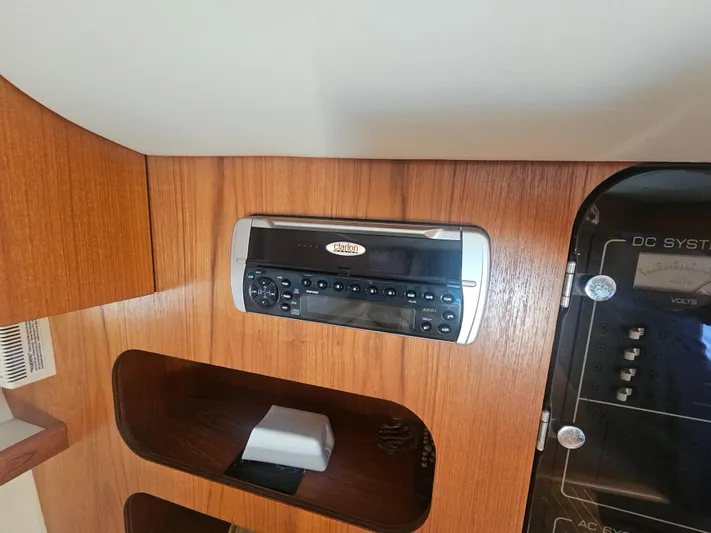 Deep Rapture Yacht Photos Pics 2003 Tiara Yachts 3100 Open LE cabin with audio system and control panel.