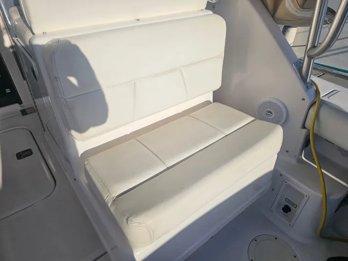 Deep Rapture Yacht Photos Pics 2003 Tiara Yachts 3100 Open LE interior seating with white upholstery and marine features.