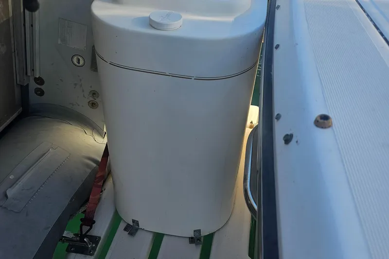 Deep Rapture Yacht Photos Pics 2003 Tiara Yachts 3100 Open LE interior with storage compartment and seating area.