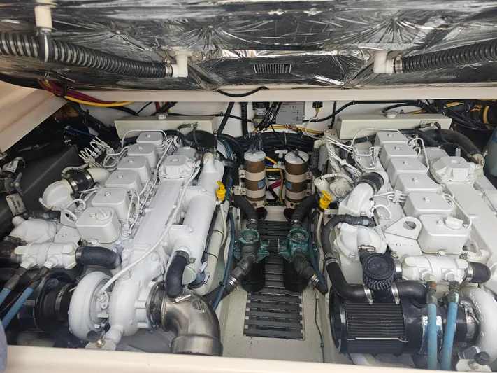 Deep Rapture Yacht Photos Pics Engine compartment of a 2003 Tiara Yachts 3100 Open LE, showcasing dual engines.