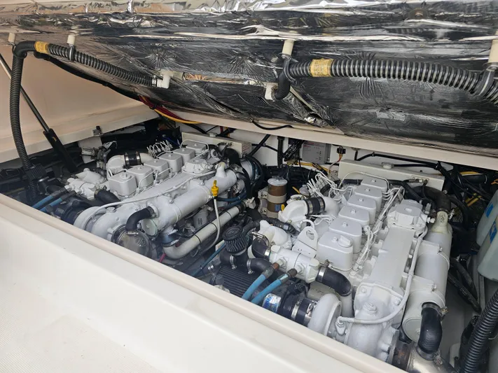 Deep Rapture Yacht Photos Pics Engine compartment of a 2003 Tiara Yachts 3100 Open LE, showcasing dual engines.