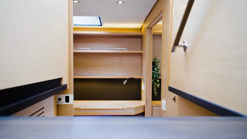 Respite At Sea Yacht Photos Pics Luxurious interior of 2018 Lagoon 560 yacht, featuring modern wood finishes and sleek design.