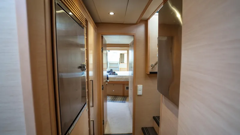 Respite At Sea Yacht Photos Pics Starboard Companionway with Full Size Refrigerator and Freezer plus extra Refrigerator and Freezer