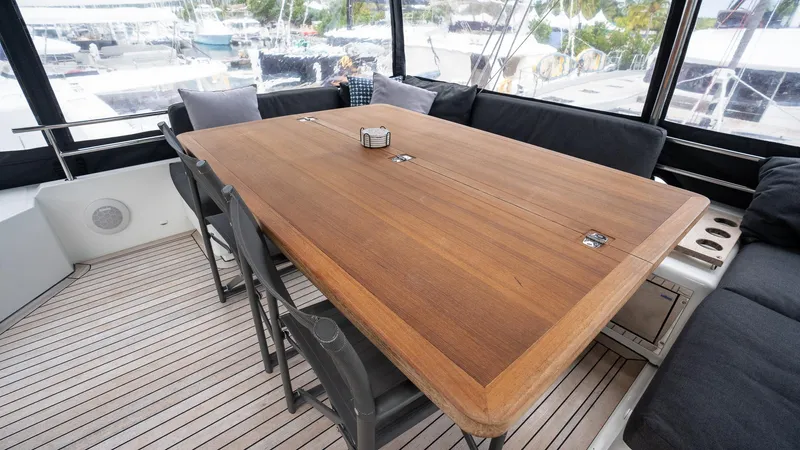 Respite At Sea Yacht Photos Pics Custom Teak Table and Beverage Refrigerator in Flybridge