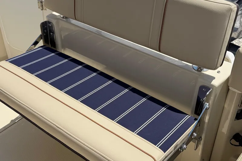  Yacht Photos Pics 2025 Ranger Tugs R-23 boat seat with blue striped cushion and beige upholstery.